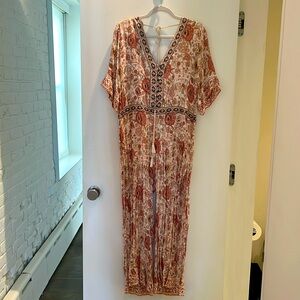 SPELL jumpsuit with split leg size S. Lining is short length.